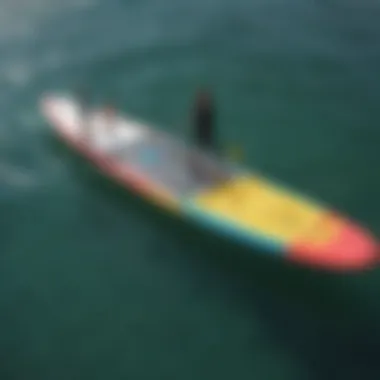 An aerial view of a SUP wing foil package being loaded for travel