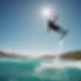 Kiteboarder soaring above turquoise waters in Baja