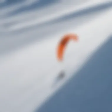 An aerial view of multiple kite snowboarders in action on a snowy field