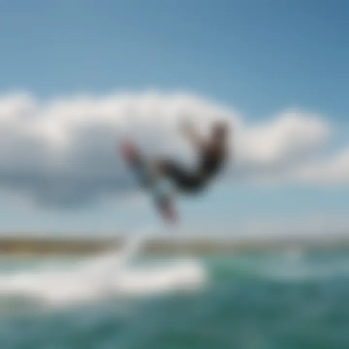 A kiteboarder gliding over clear blue waters under a sunny sky