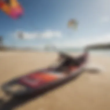 Close-up of kite and board on sandy beach