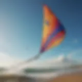 A vibrant kite soaring against a clear blue sky