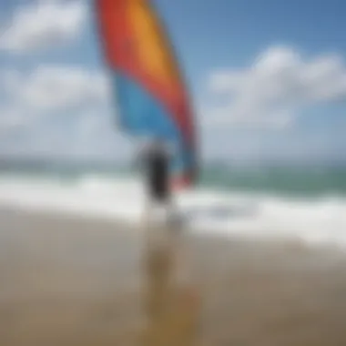 Instructor guiding a novice kite surfer on the beach