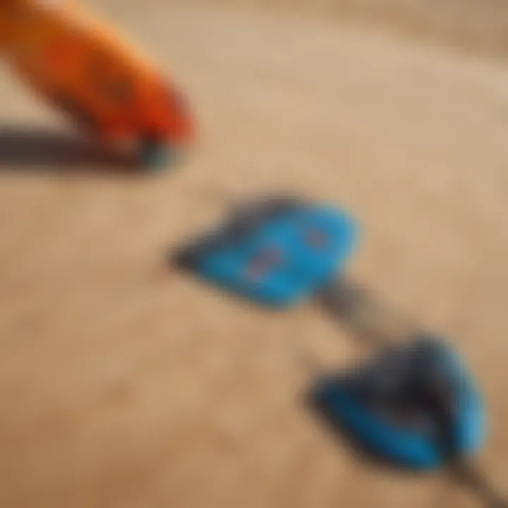 Essential kiteboarding equipment displayed on the sand