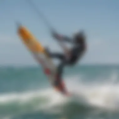 A kiteboarder executing a compact ride maneuver over the waves