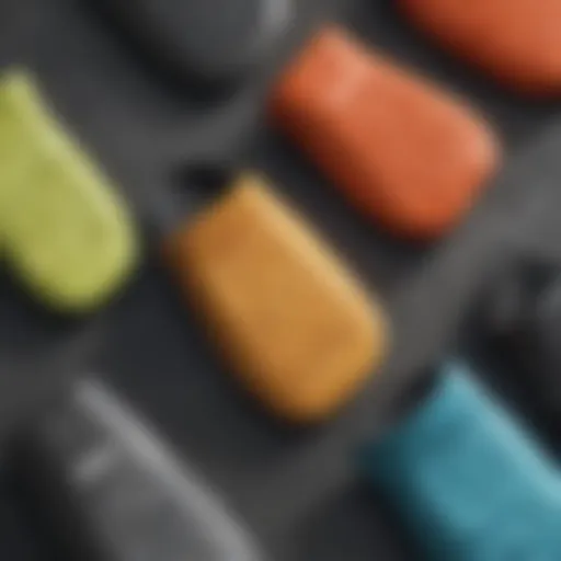 A close-up view of various types of surf mittens on a textured surface