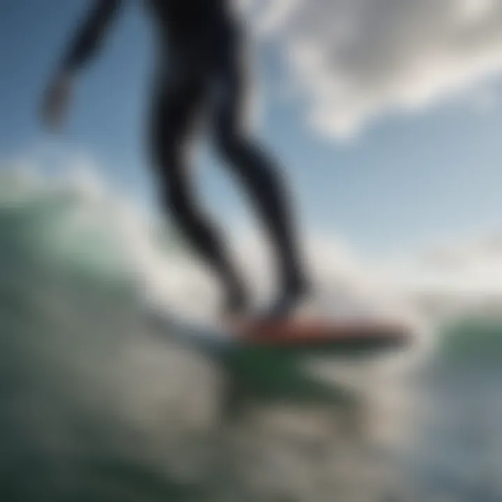 Surfer wearing wetsuit socks in action on a wave