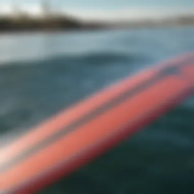 A close-up view of a hydro foil surf board showcasing its sleek design and hydrodynamic features.