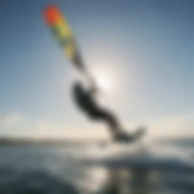 A serene water surface reflecting a kiteboarder using a hydrofoil.