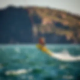 A wind surfer gracefully hydrofoiling above the water